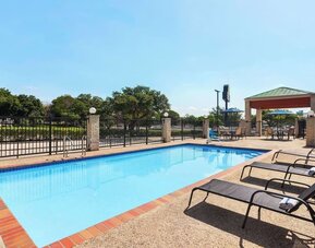 Outdoor pool at Days Inn By Wyndham San Antonio Near Fiesta Park.