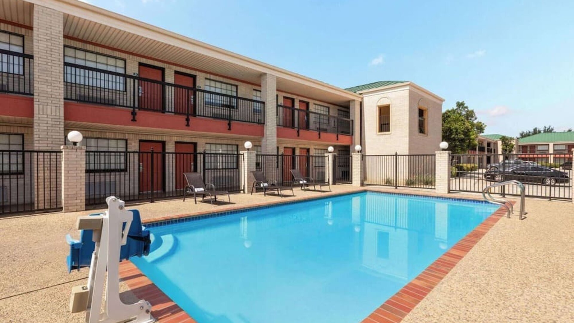 Outdoor pool at Days Inn By Wyndham San Antonio Near Fiesta Park.