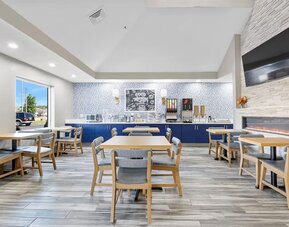 Dining room at AmericInn By Wyndham Urbana.
