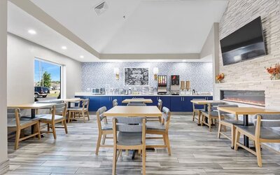 Dining room at AmericInn By Wyndham Urbana.