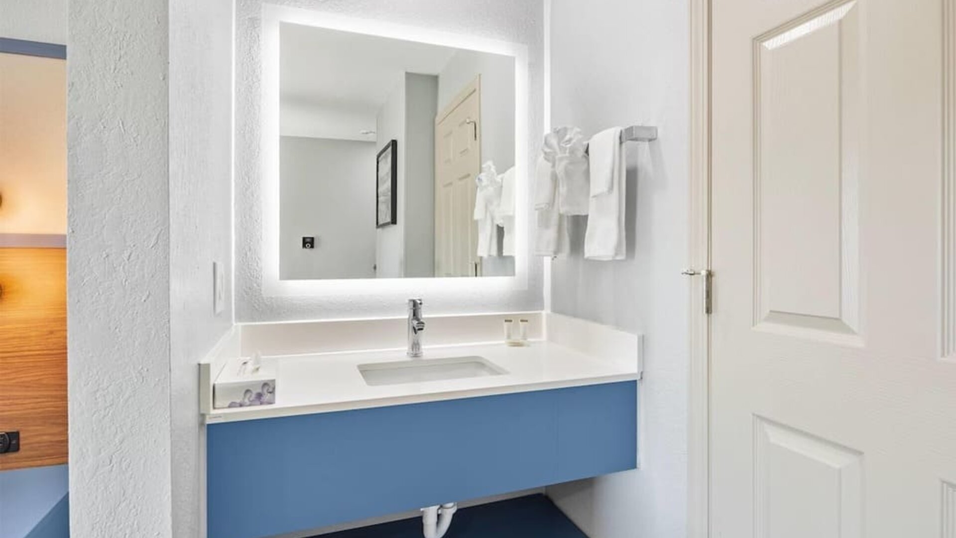 Guest bathroom at AmericInn By Wyndham Urbana.