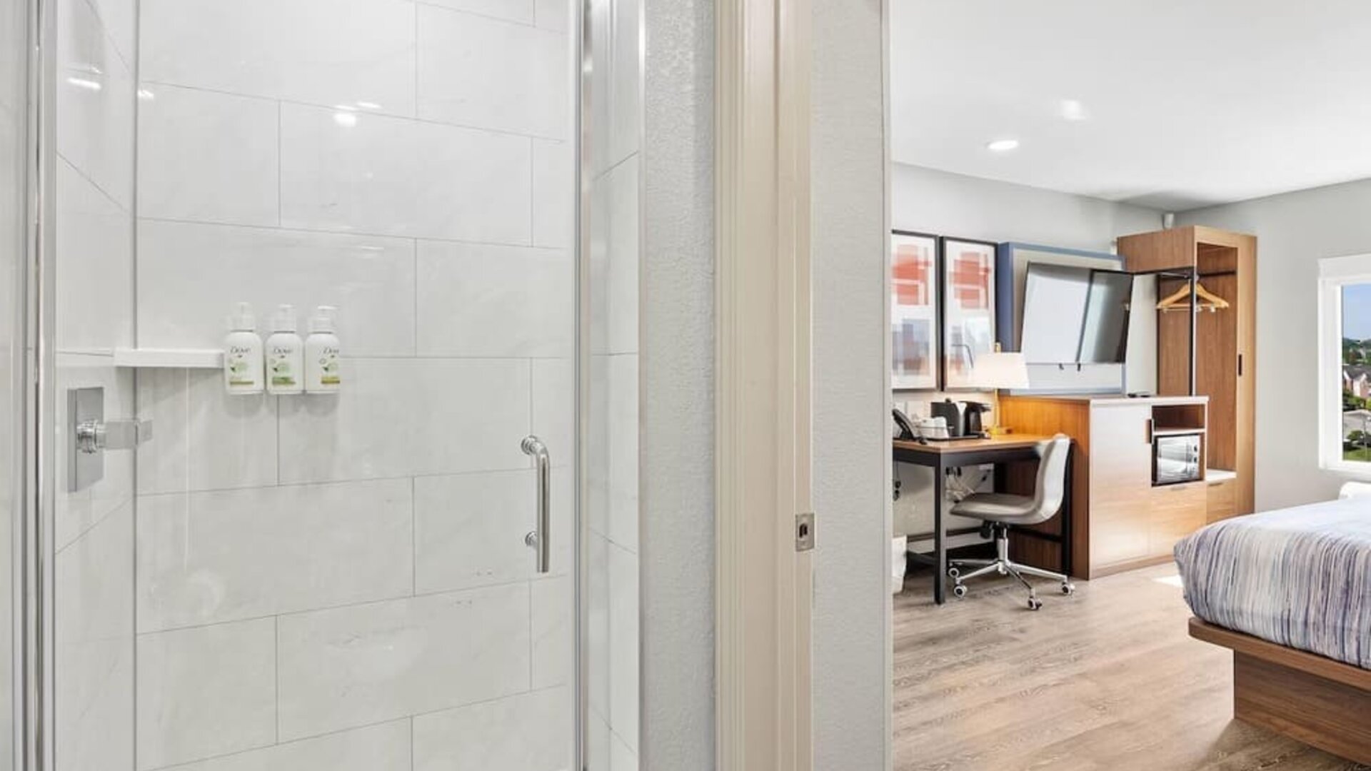 Guest bathroom at AmericInn By Wyndham Urbana.