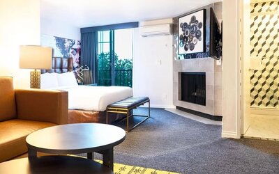 Day use suite with living room and fireplace at Montrose At Beverly Hills.