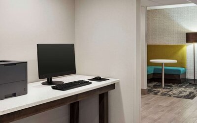 Business center with PC, printer and workspace at Hampton Inn Chicago-O'Hare International Airport.