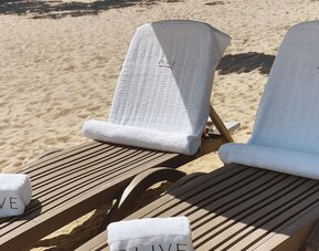 Beach loungers at Aire De O:live.