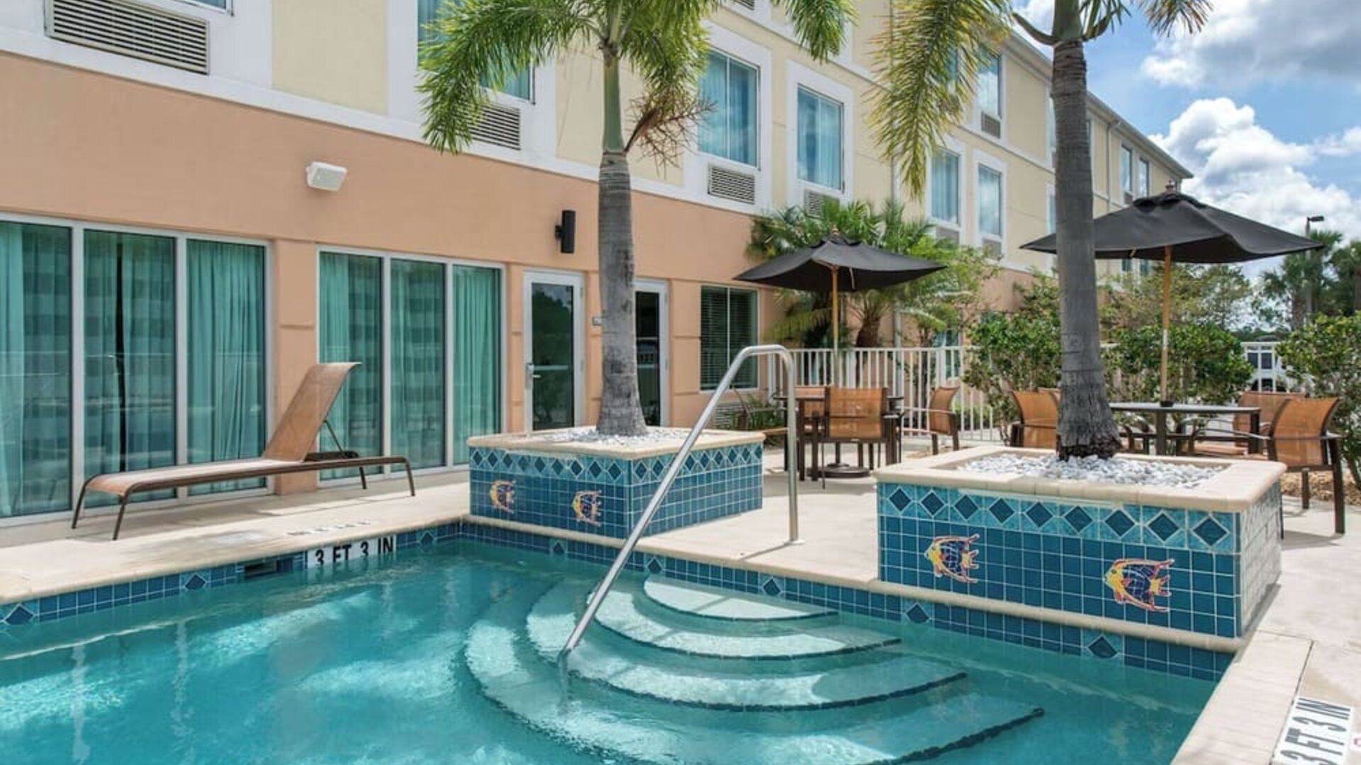 Outdoor pool at Sleep Inn & Suites Port Charlotte - Punta Gorda.