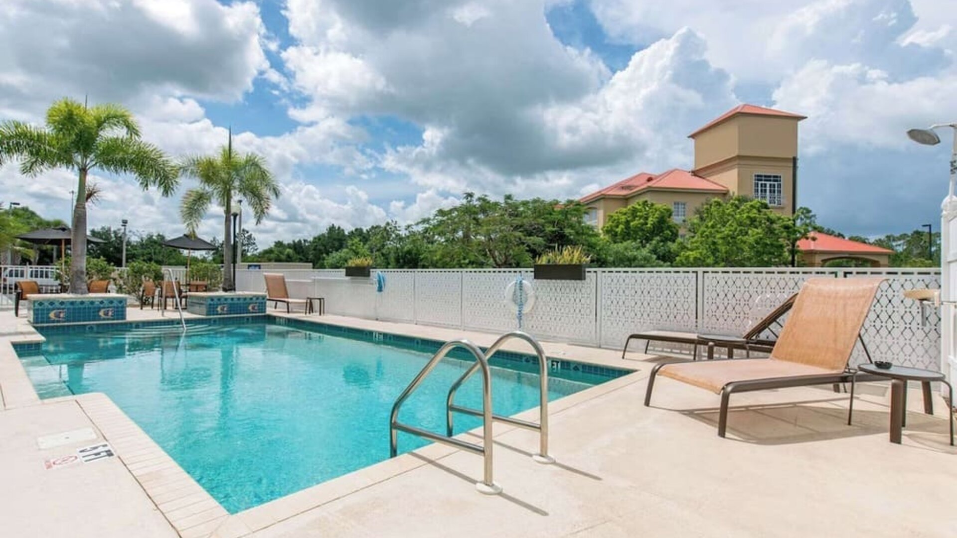 Outdoor pool at Sleep Inn & Suites Port Charlotte - Punta Gorda.