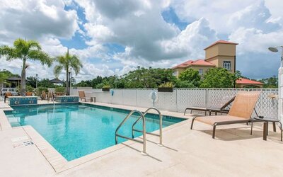 Outdoor pool at Sleep Inn & Suites Port Charlotte - Punta Gorda.