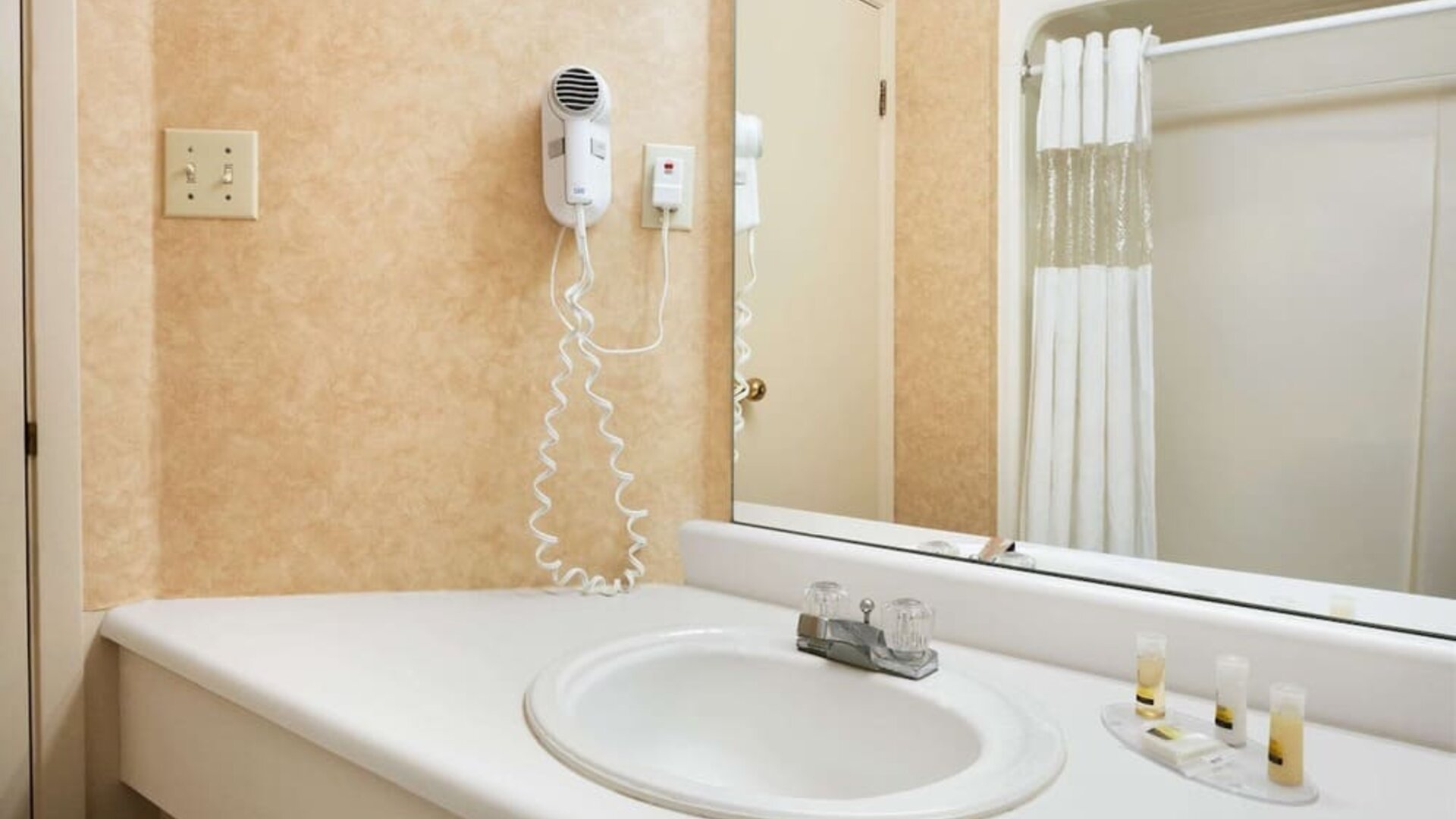 Guest bathroom at Days Inn By Wyndham Brantford.