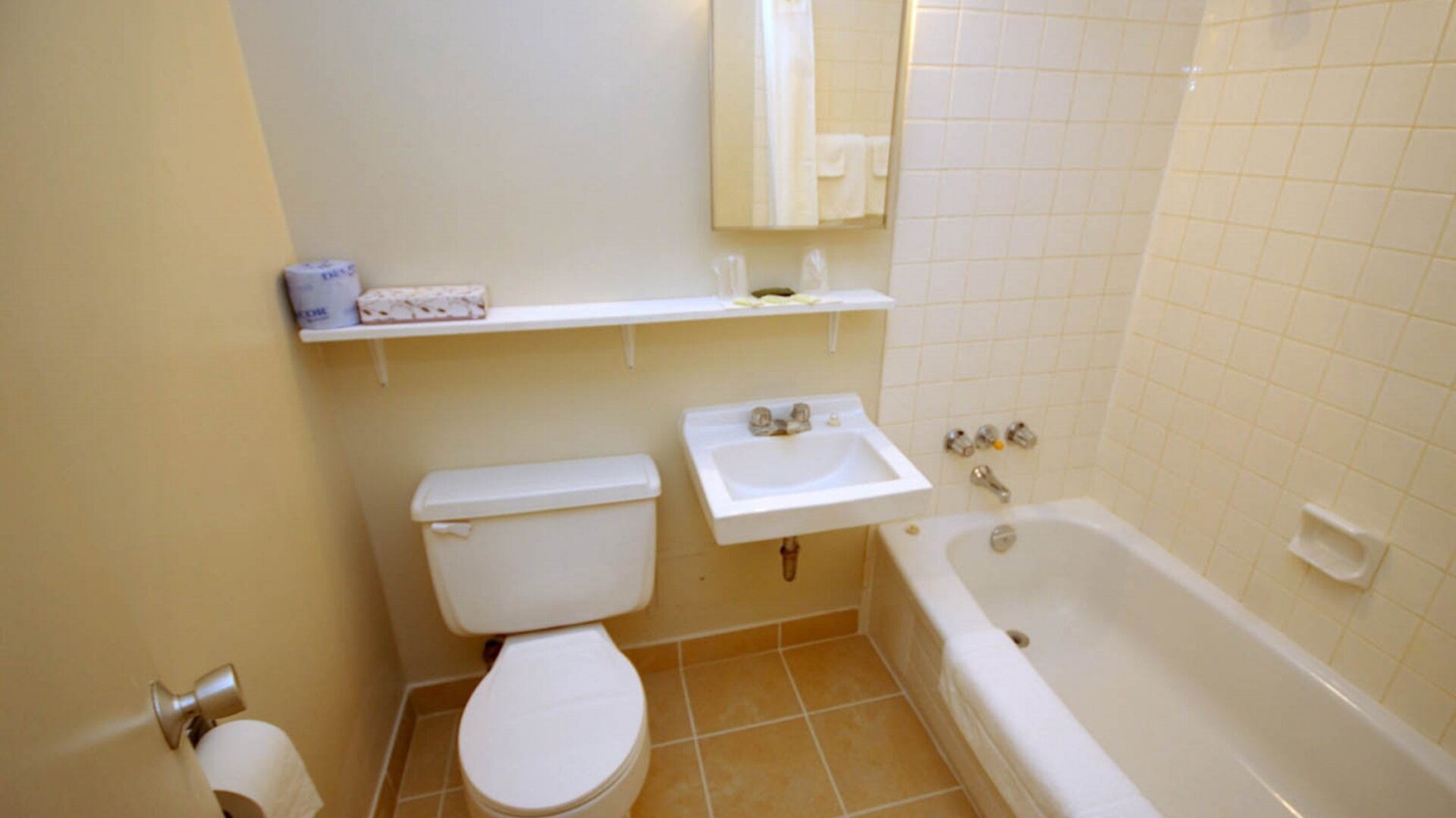 Guest bathroom with tub at Alexandra Hotel.