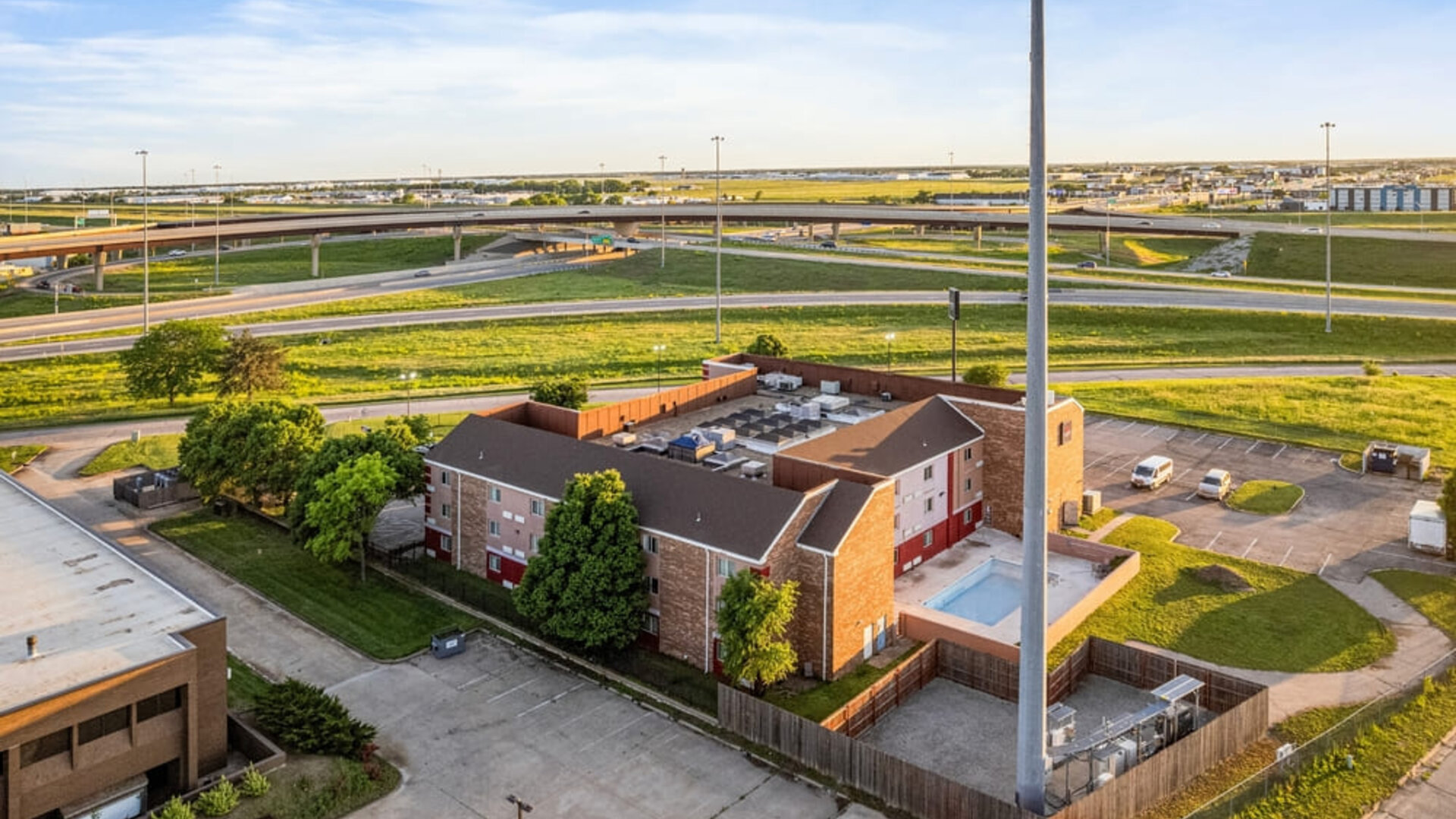 Property exterior at Coratel Plus Suites Wichita West Airport.