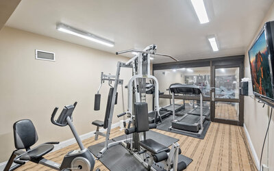 Fitness center at Coratel Plus Suites Wichita West Airport.