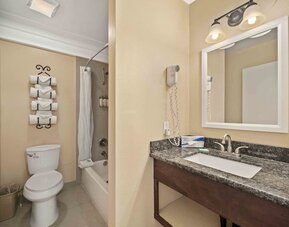 Guest bathroom at Lemon Tree Hotel & Suites Anaheim.