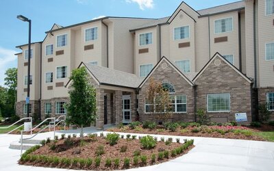 Hotel exterior at WeStay Suites Belle Chasse.