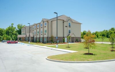 Hotel exterior at WeStay Suites Belle Chasse.