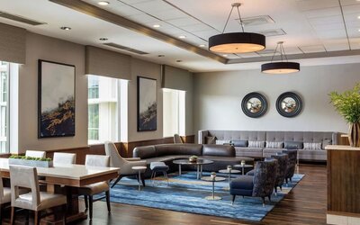 Lounge area with natural light at Boston Marriott Newton.