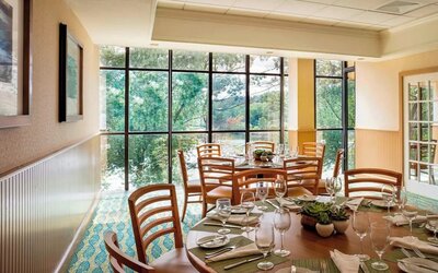 Dining area with natural light perfect for coworking at Boston Marriott Newton.