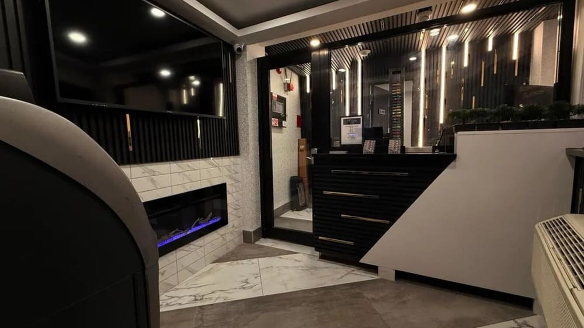 Reception desk at THE VINE HOTEL BRONX.