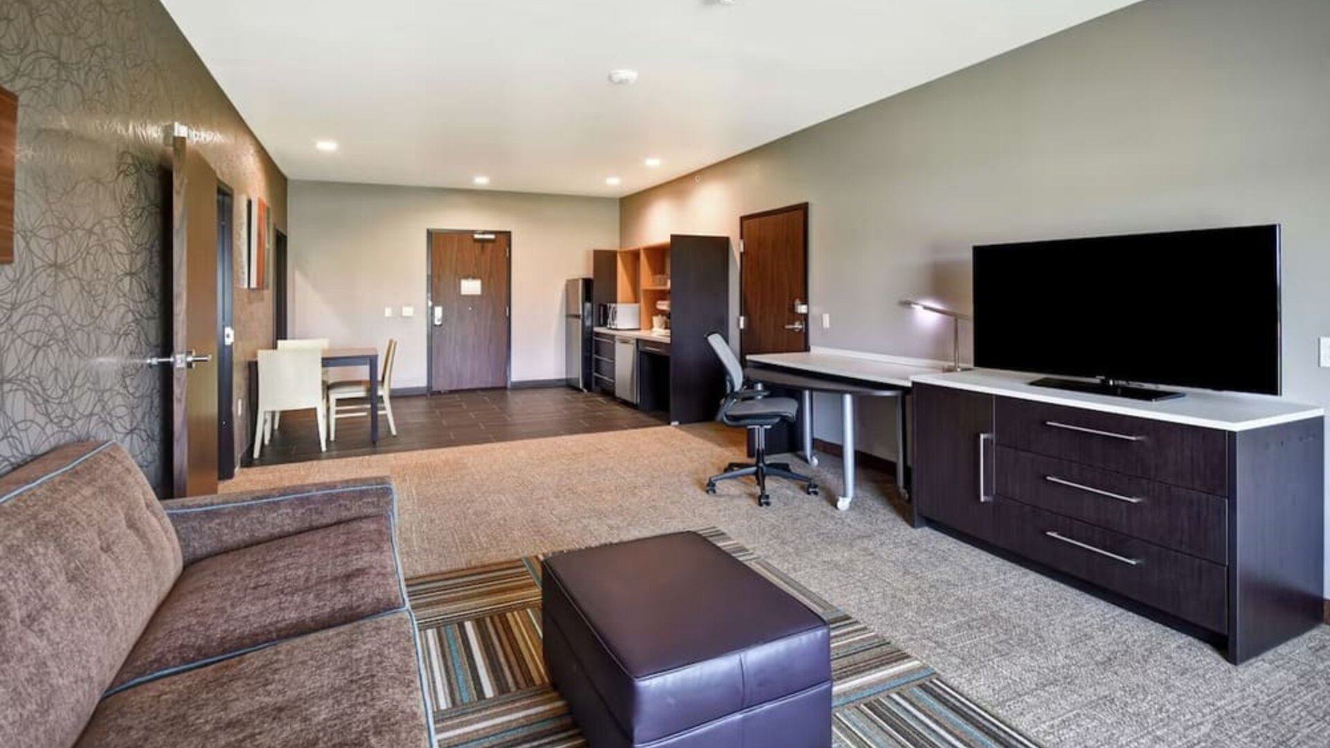 TV lounge area at Home2 Suites By Hilton El Reno.