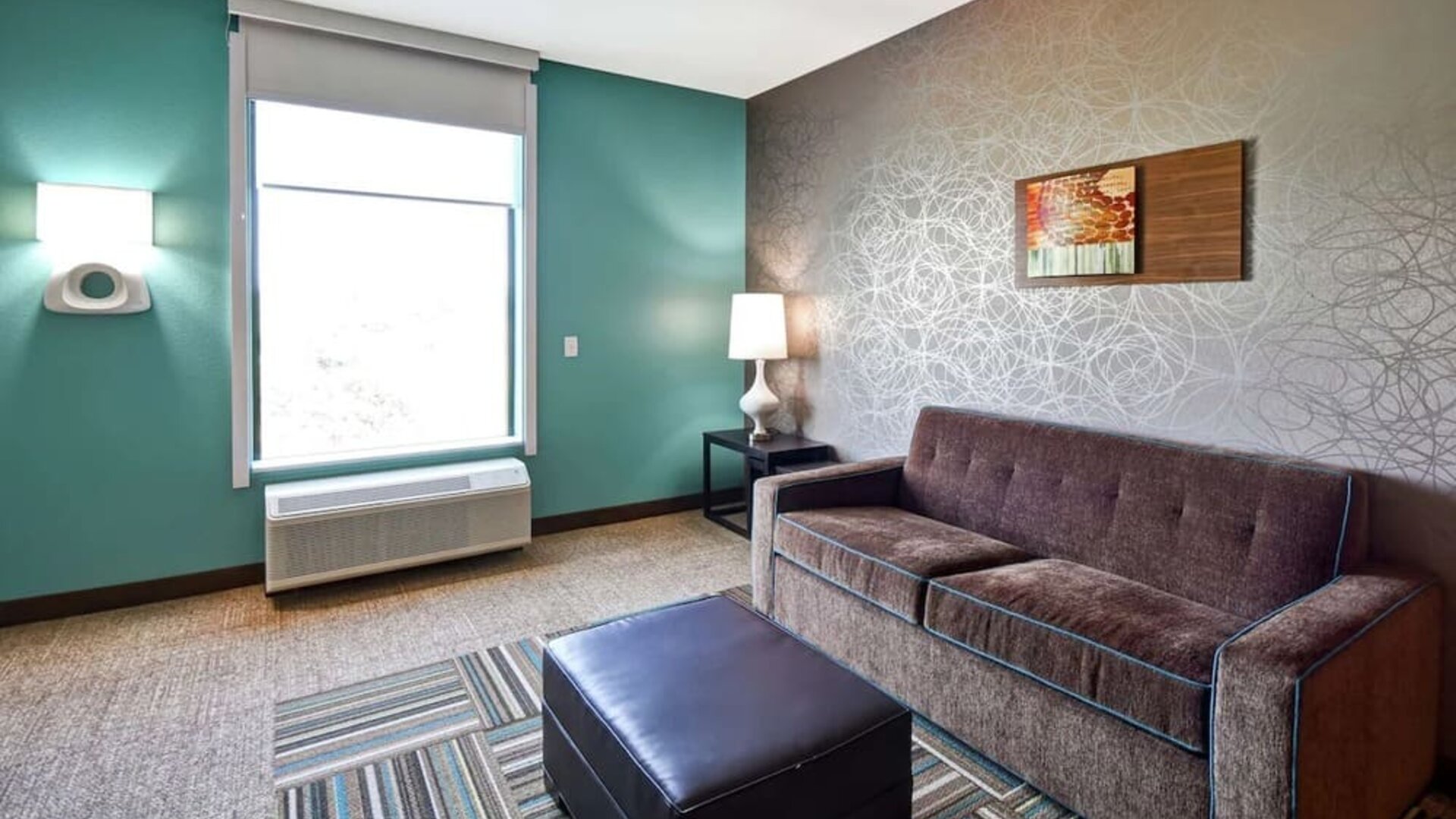 TV lounge area at Home2 Suites By Hilton El Reno.