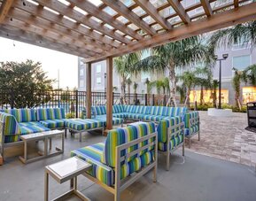Outdoor terrace at Homewood Suites By Hilton Orlando Theme Parks.