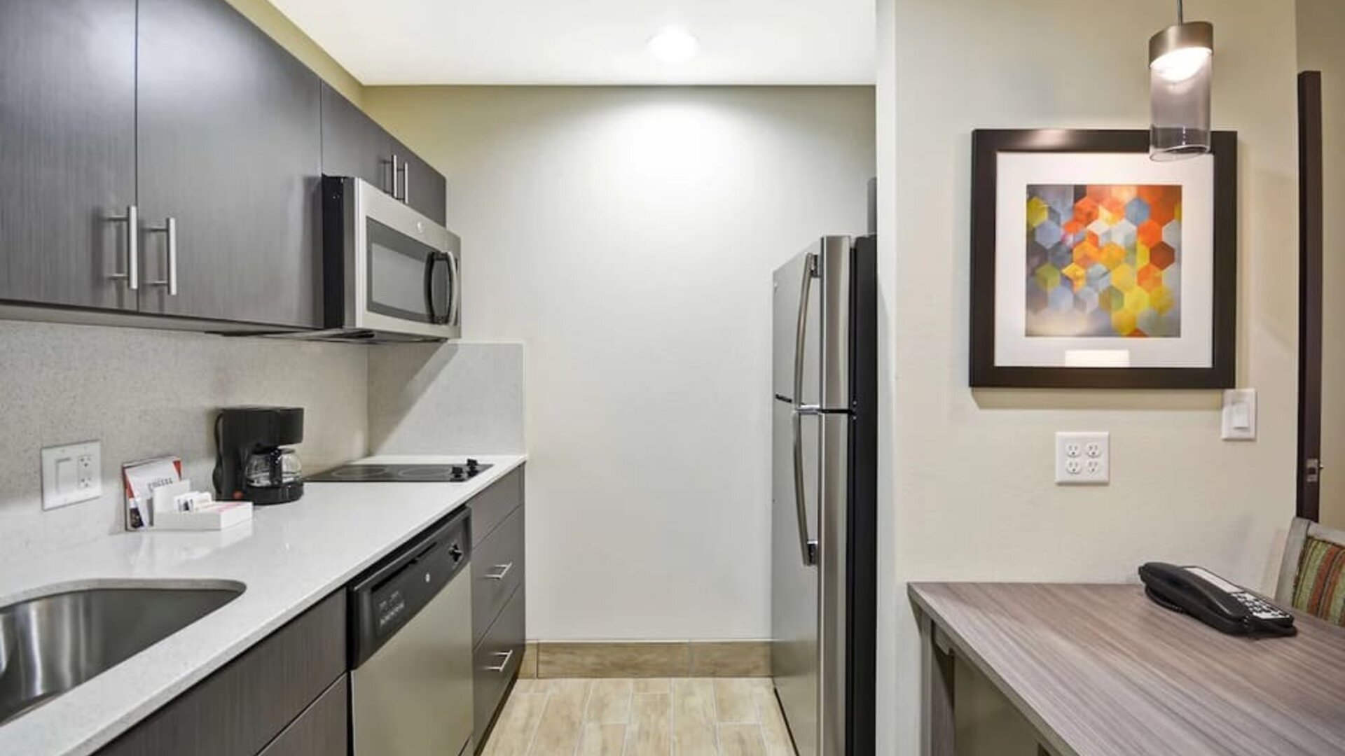 Kitchen at Homewood Suites By Hilton Orlando Theme Parks.