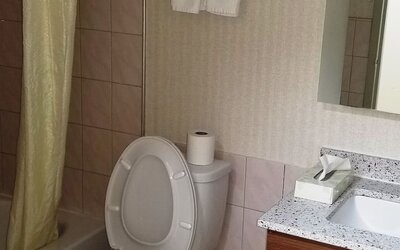 Guest bathroom at Baymont By Wyndham Montreal Airport.