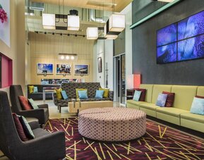 Lounge with comfortable chairs perfect for coworking at Aloft Manhattan Downtown - Financial District.