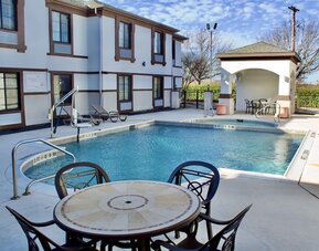 Outdoor pool at Quality Inn & Suites Irving DFW Airport South.