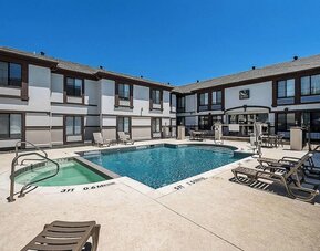Outdoor pool at Quality Inn & Suites Irving DFW Airport South.