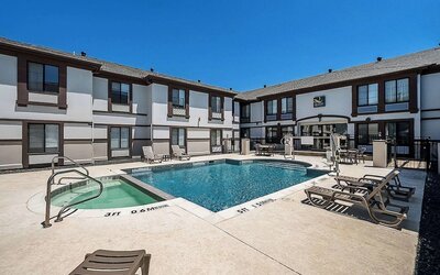 Outdoor pool at Quality Inn & Suites Irving DFW Airport South.
