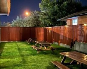 Outdoor terrace and garden at Quality Inn & Suites Vernon.