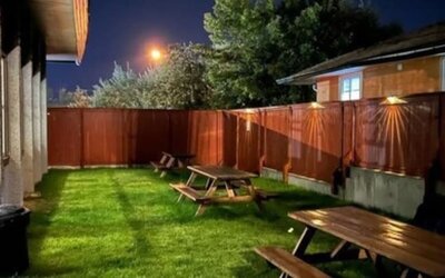 Outdoor terrace and garden at Quality Inn & Suites Vernon.