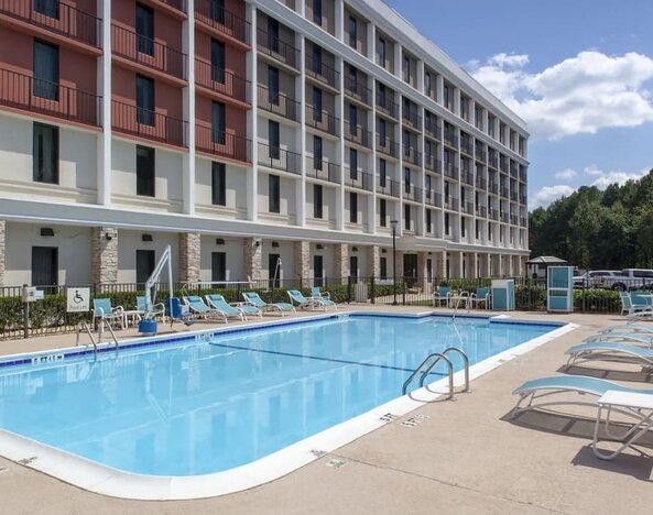 Outdoor pool at Holiday Inn Express Atlanta Airport - College Park By IHG.