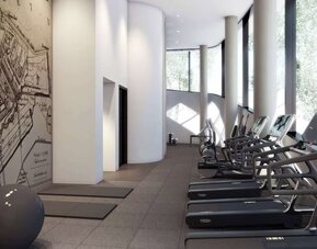 Fitness center with natural light at Hilton Amsterdam Airport Schiphol.
