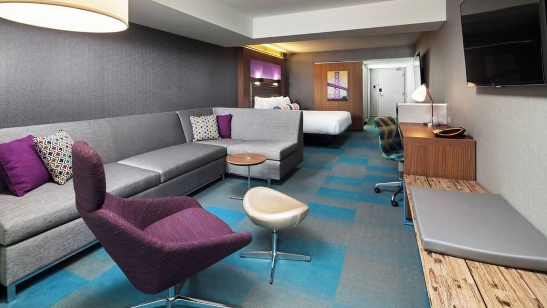 Day use room with living area and work desk at Aloft SFO.