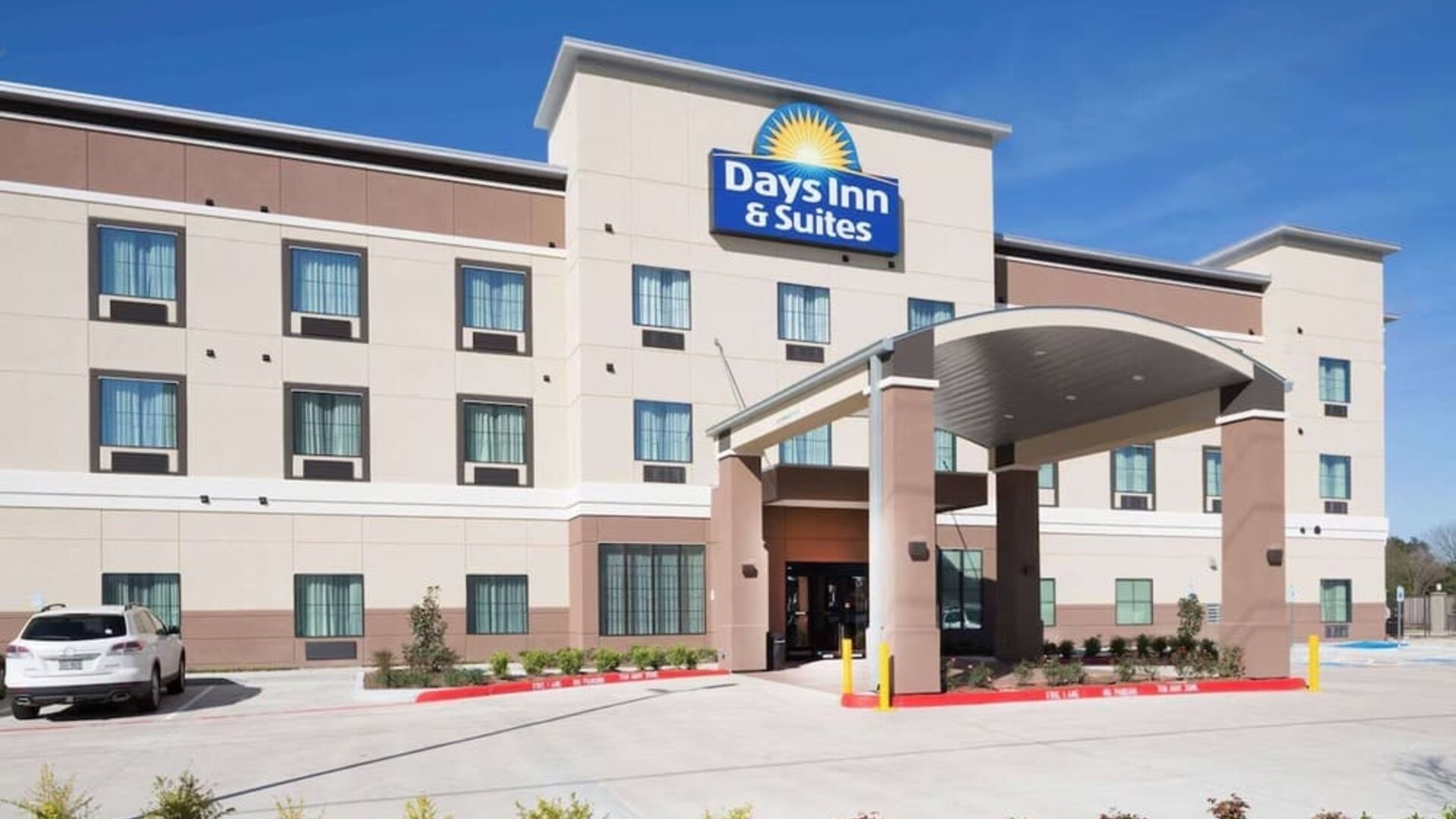 Hotel exterior at Days Inn & Suites By Wyndham Houston NW Cypress.