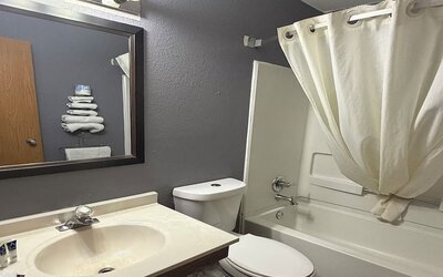 Guest bathroom at Coratel Inn And Suites By Jasper Stillwater.