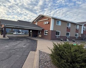 Hotel exterior at Coratel Inn And Suites By Jasper Stillwater.