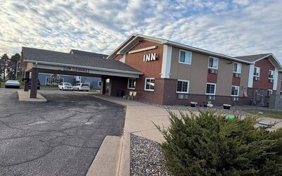 Hotel exterior at Coratel Inn And Suites By Jasper Stillwater.
