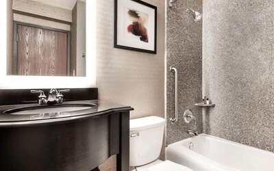 Guest bathroom at Crowne Plaza Milwaukee Airport By IHG.