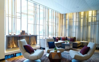 Lounge area with comfortable seating and fireplace at Hotel 48LEX New York.