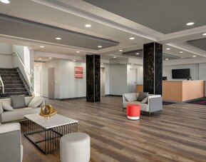 Lobby area at Ramada By Wyndham West Edmonton Hotel & Suites.
