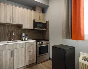 Kitchen at Ramada By Wyndham West Edmonton Hotel & Suites.