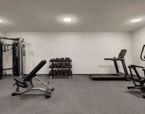 Gym at Ramada By Wyndham West Edmonton Hotel & Suites.