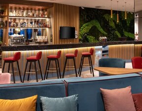 Hotel bar and lounge at Hampton By Hilton Riga Airport.