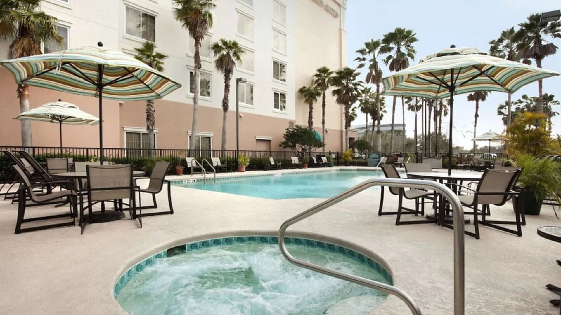 Outdoor pool at Embassy Suites By Hilton Orlando Airport.