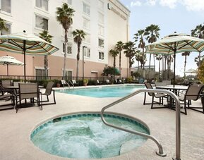 Outdoor pool at Embassy Suites By Hilton Orlando Airport.
