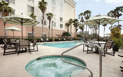 Outdoor pool at Embassy Suites By Hilton Orlando Airport.