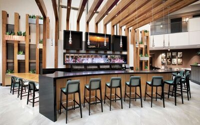 Hotel bar and lounge at Embassy Suites By Hilton Orlando Airport.